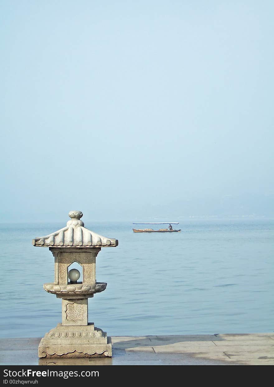 Little tower and boat on xizi lake, hangzhou city, china