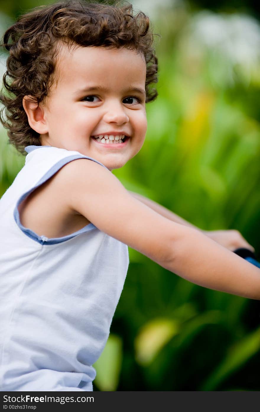 A young boy on his first bike in the park. A young boy on his first bike in the park