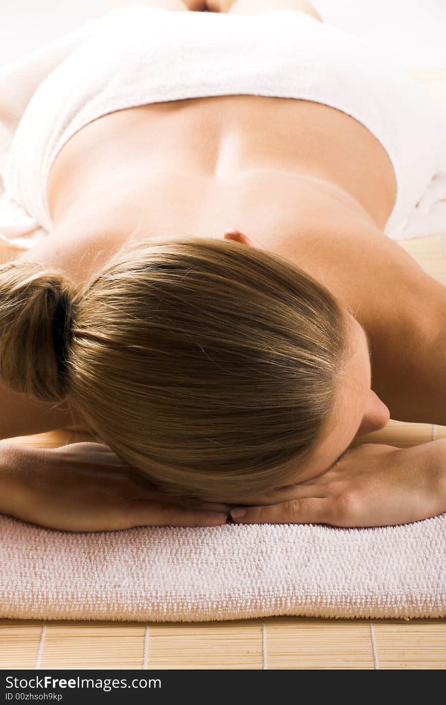 Young beautiful woman in a spa with towels. Young beautiful woman in a spa with towels