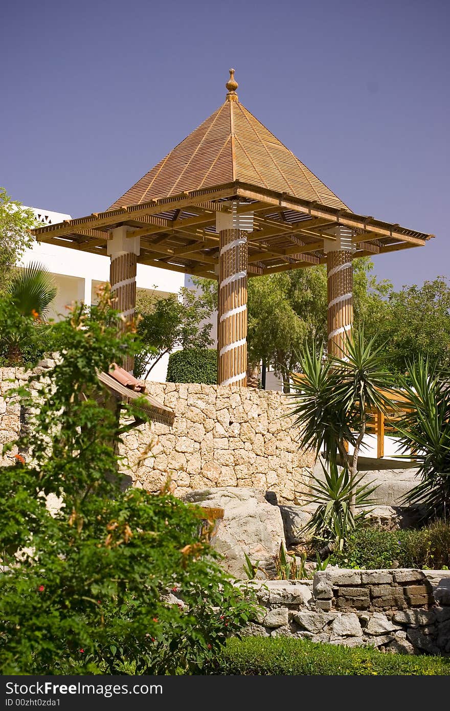 Beautiful tropical garden with decorative pavilion