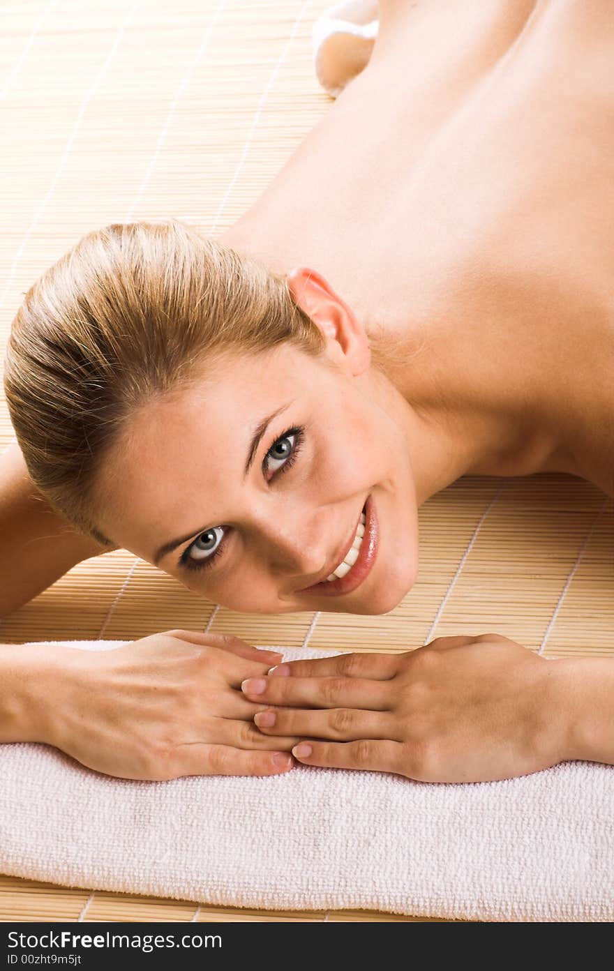 Young beautiful woman in a spa with towels. Young beautiful woman in a spa with towels