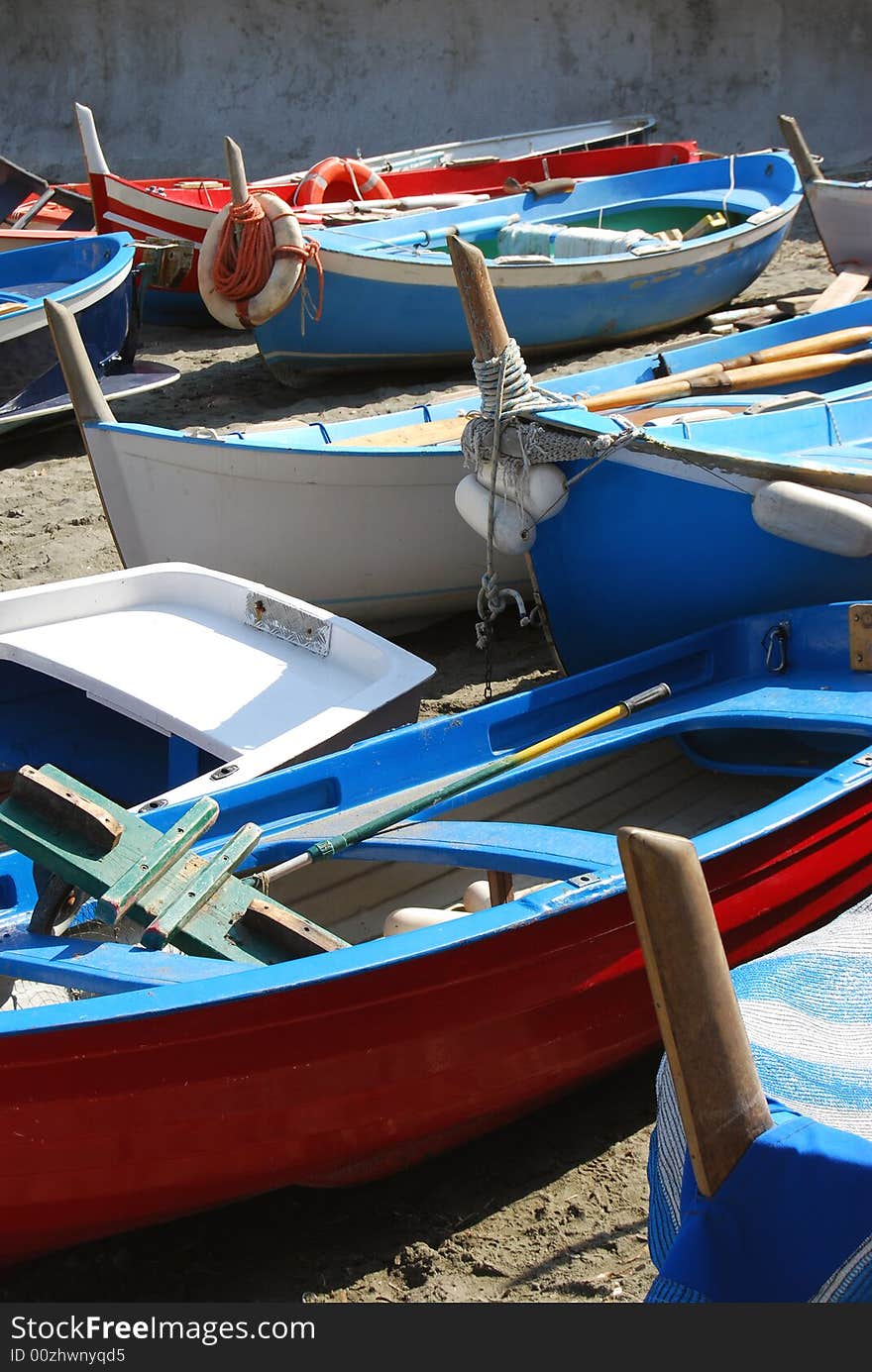 Coloured boats on a beach