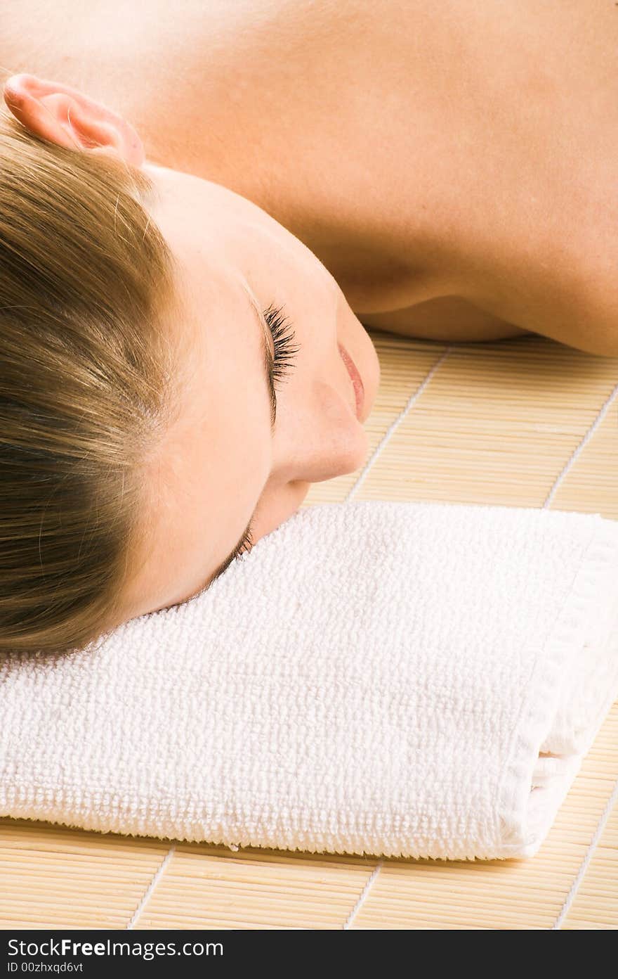 Young beautiful woman in a spa with towels. Young beautiful woman in a spa with towels