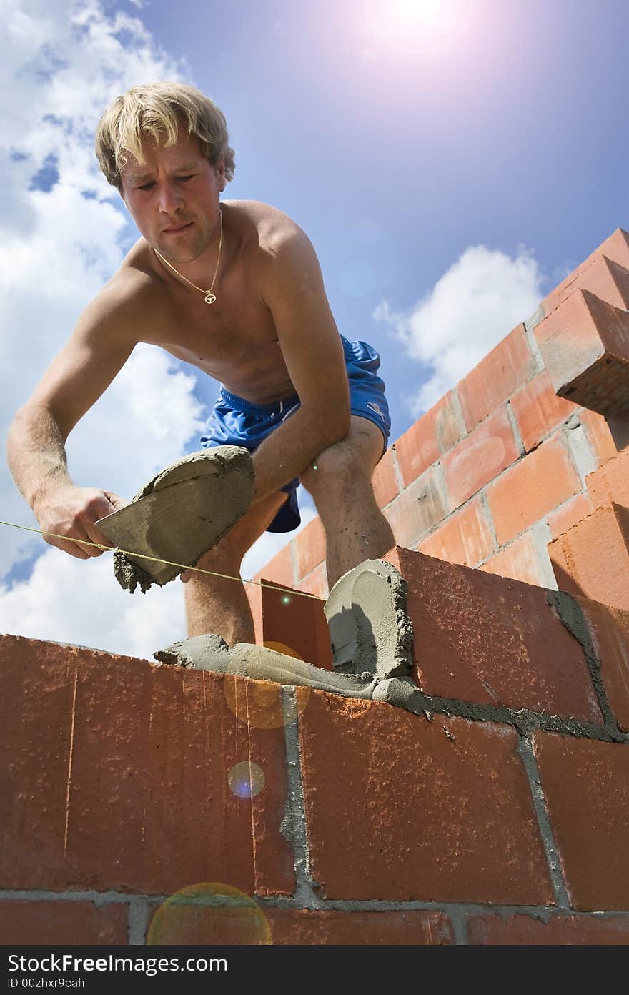 Construction worker building a wall