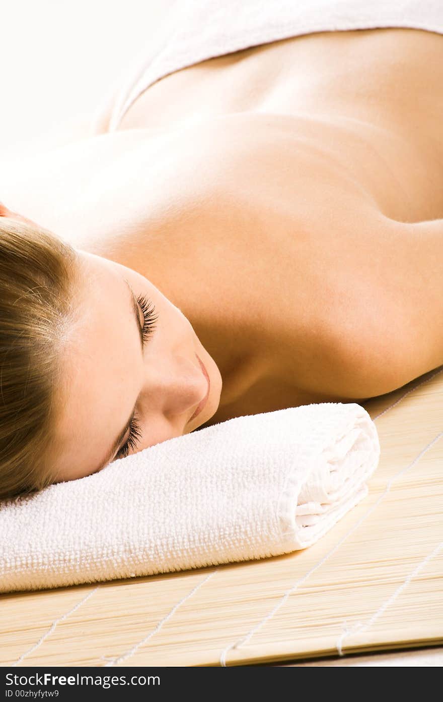 Young beautiful woman in a spa with towels. Young beautiful woman in a spa with towels