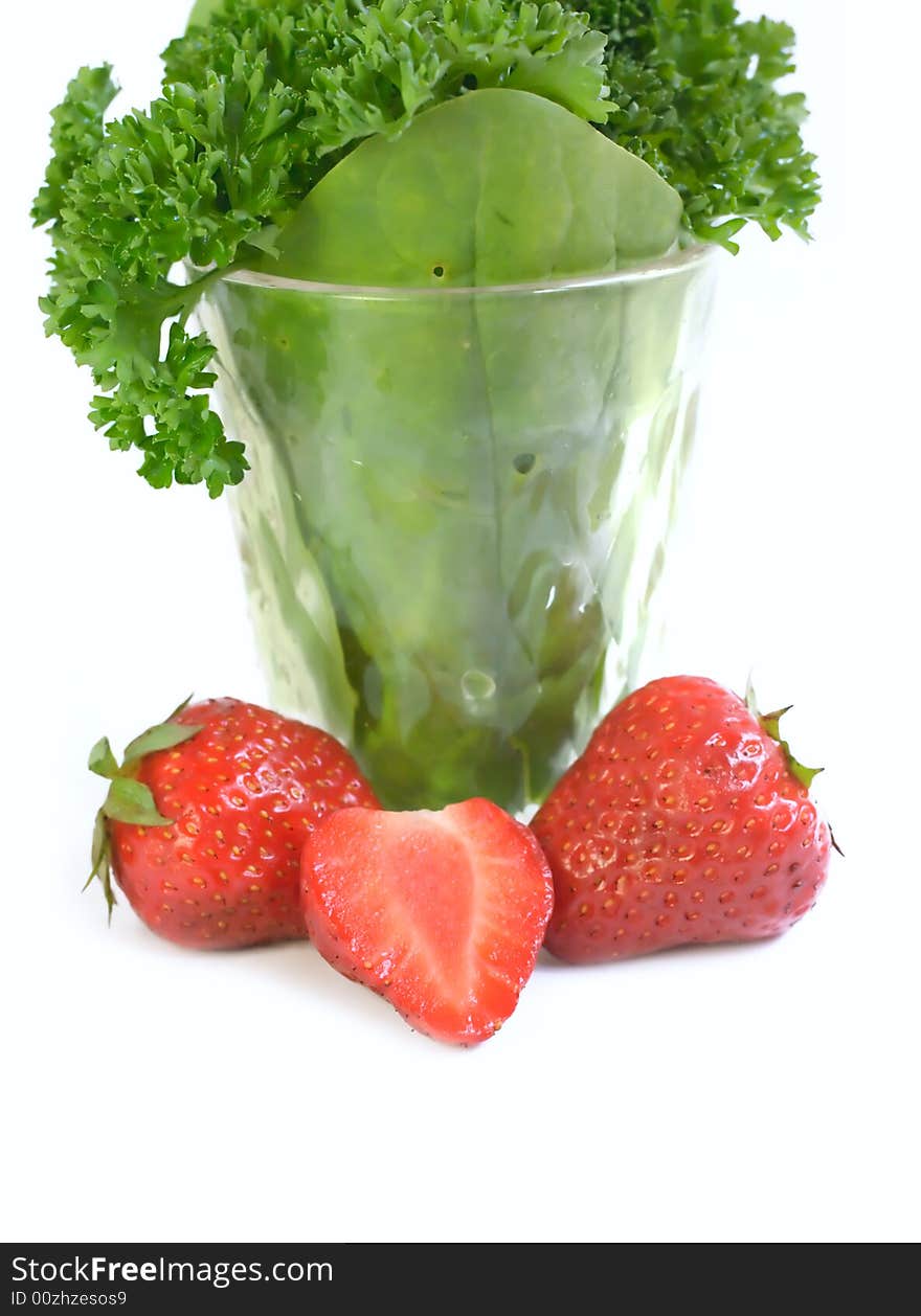 Strawberries and plants isolated on white