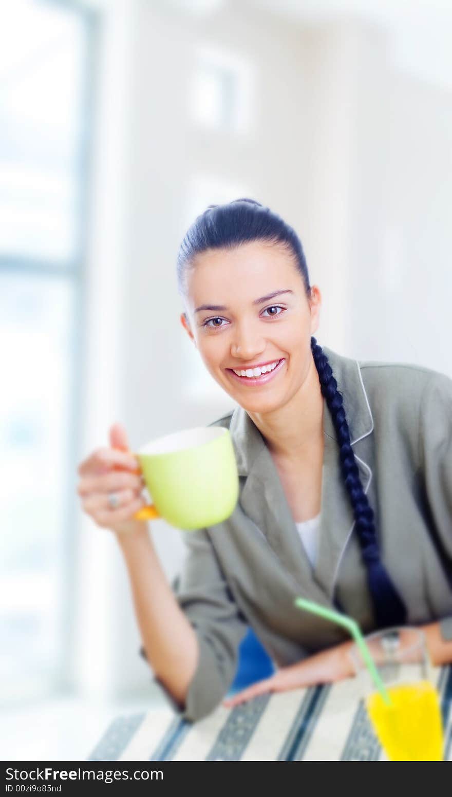 Young businesswoman having coffee break