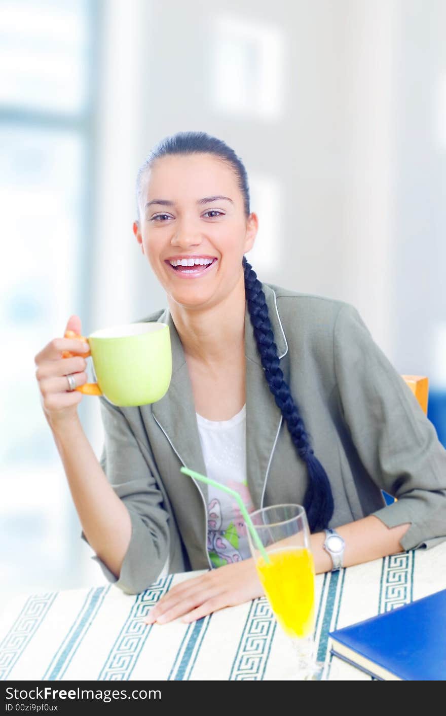 Young businesswoman having coffee break