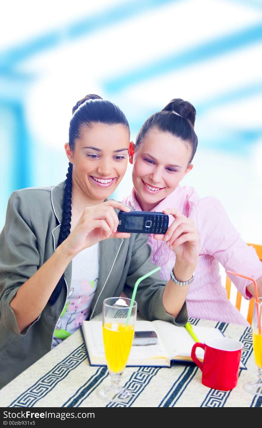 Two young businesswomen taking picture