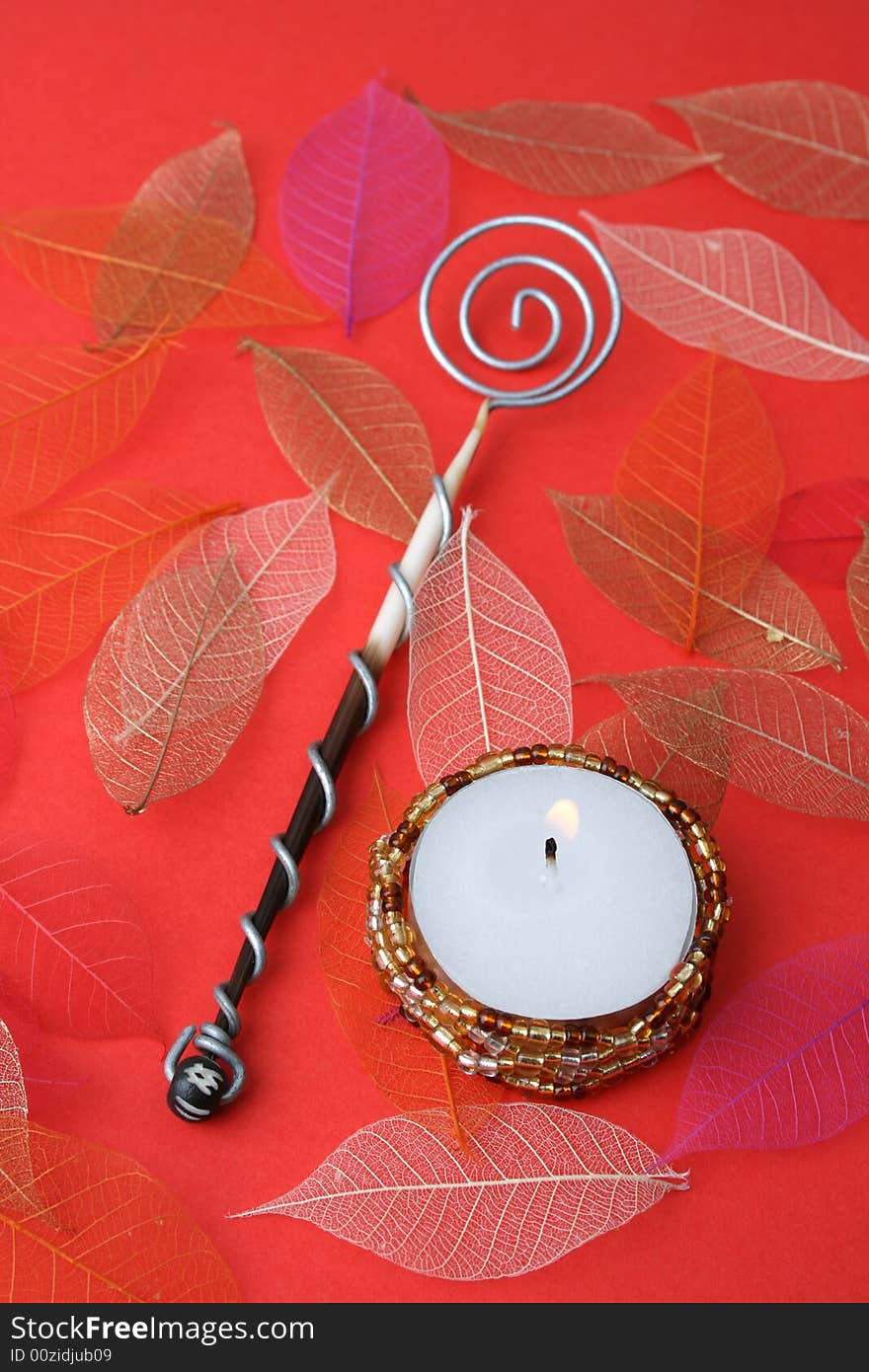 Olive Spoon and candle. FOCUS ON CANDLE