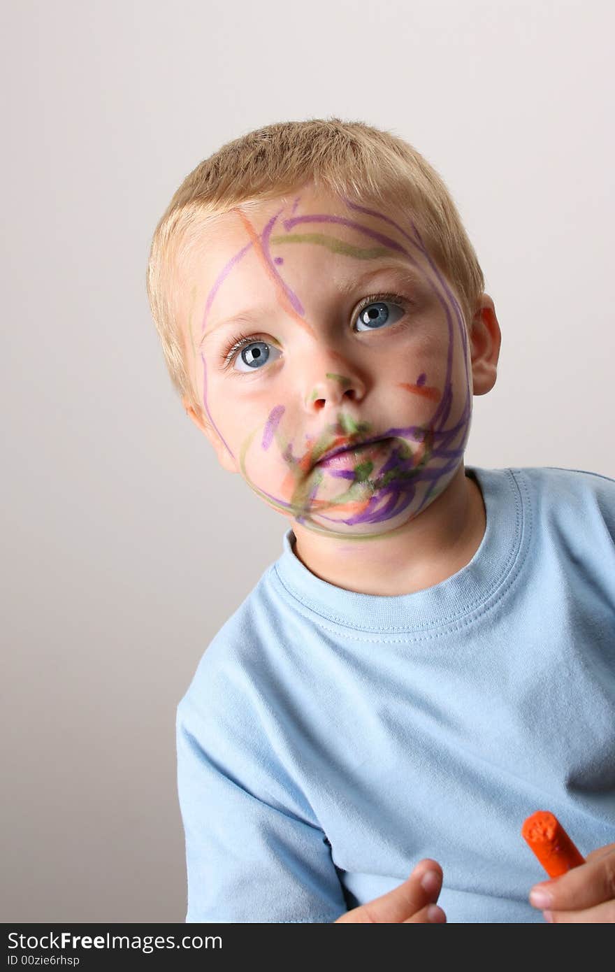 Laughing Toddler playing with colored pens making a mess. Laughing Toddler playing with colored pens making a mess