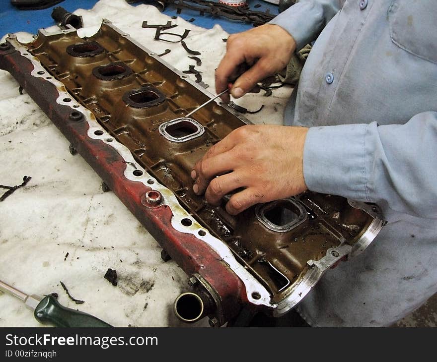 Close-up of automechanic's hands placing new seals