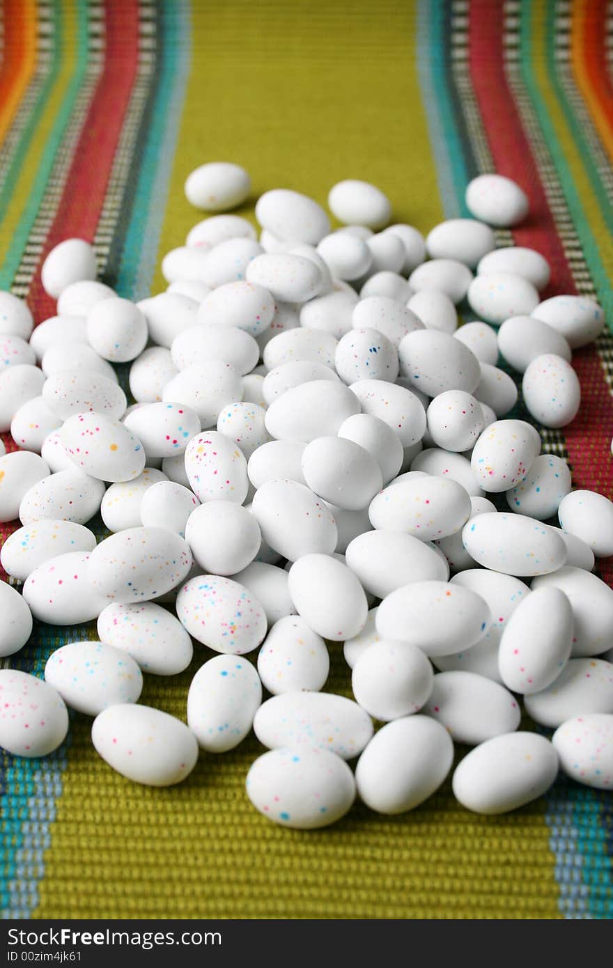 Miniature speckled easter eggs on a green placemat