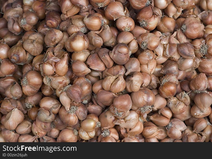 Shallots at a market, background abstract. Shallots at a market, background abstract