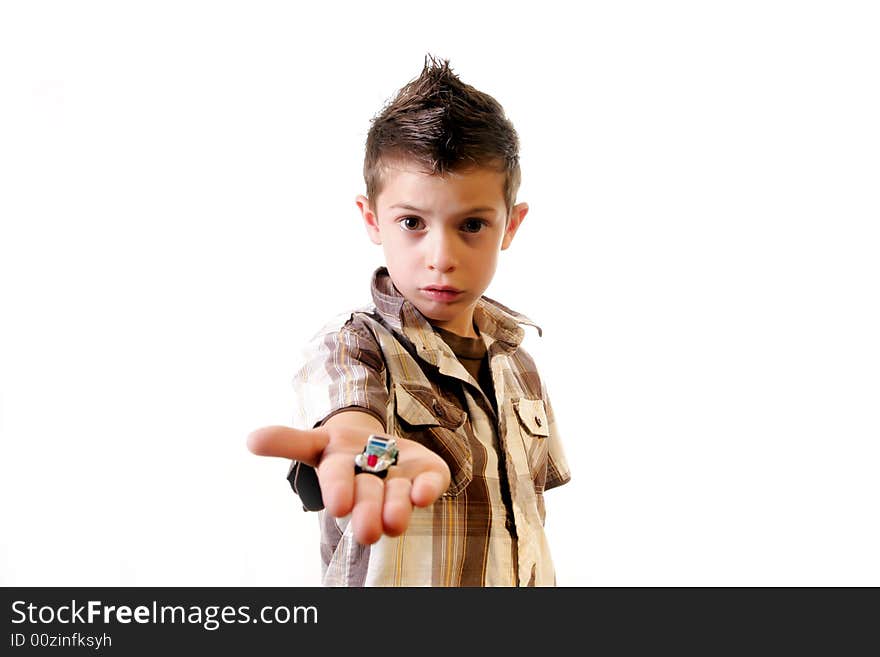 Six year old boy offering a small toy car