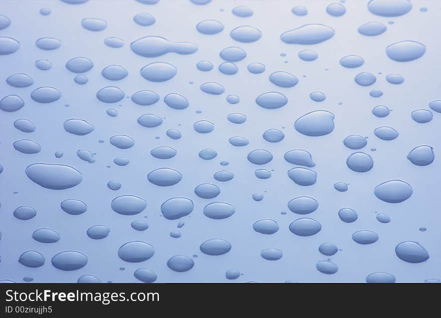 Blue droplets on clean blue  surface