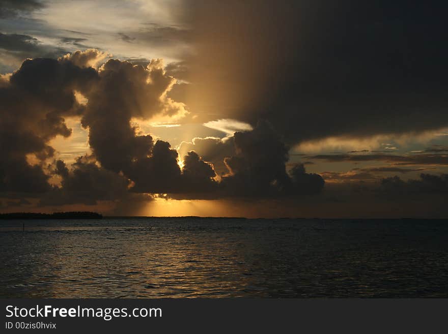 Beautiful sunset, with string clouds and rippeling water. Beautiful sunset, with string clouds and rippeling water