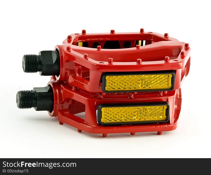 Red cycling pedals isolated on white background