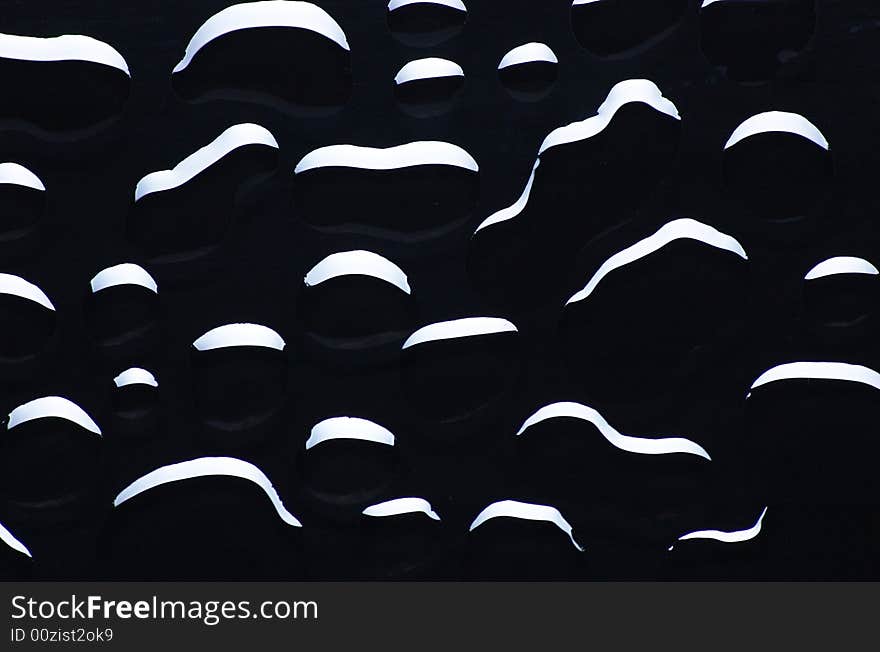 Abstract of black droplets on clean surface