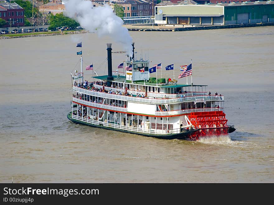 Tour boat with a red vessel