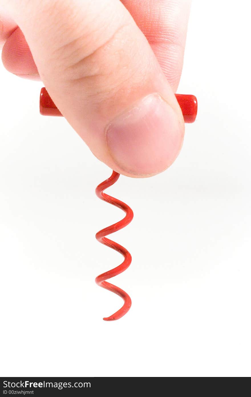 Hand with a red bottle-screw (on white). Hand with a red bottle-screw (on white)