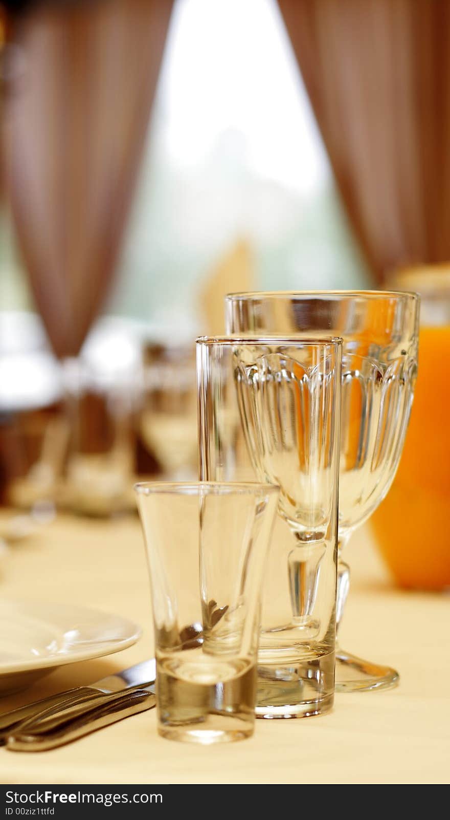 Glassware on Banquet Table in Restaurant. Focus on Glass. Glassware on Banquet Table in Restaurant. Focus on Glass