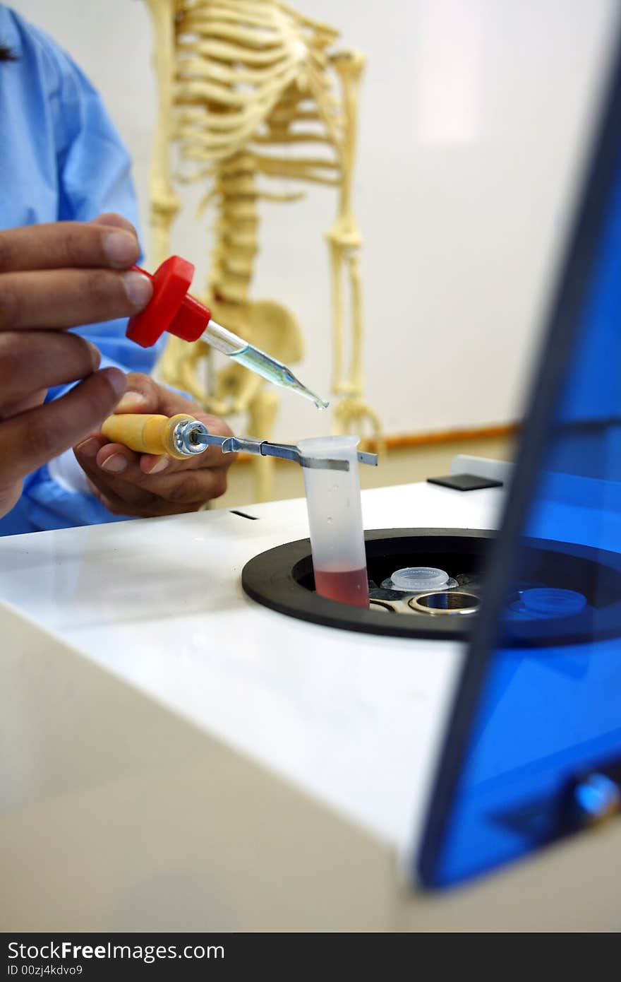 Scientist holding blood sample fro analysis. Scientist holding blood sample fro analysis