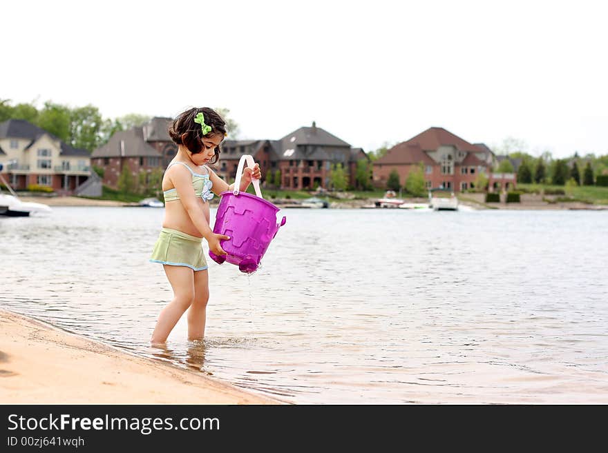 2 year old having fun in the lake. 2 year old having fun in the lake