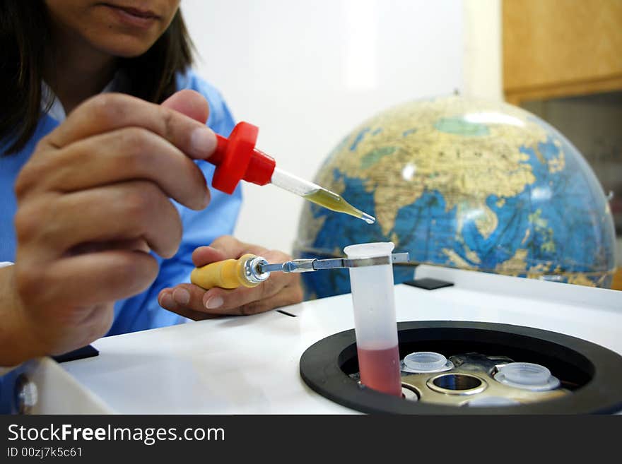 Scientist holding blood sample for analysis. Scientist holding blood sample for analysis