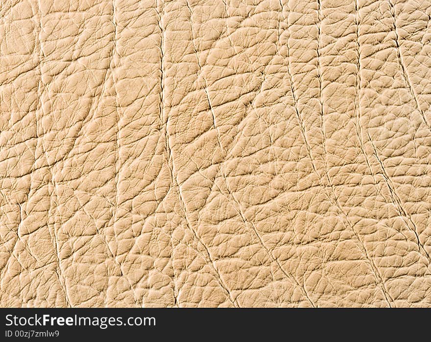 Natural qualitative beige leather texture. Close up. Natural qualitative beige leather texture. Close up.