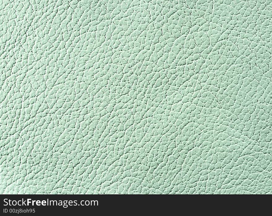 Natural qualitative light green leather texture. Close up. Natural qualitative light green leather texture. Close up.