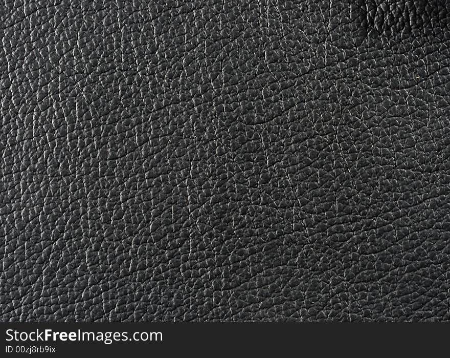 Natural qualitative black leather texture. Close up. Natural qualitative black leather texture. Close up.