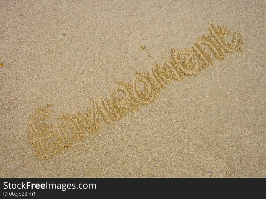 The word environement written in Sand