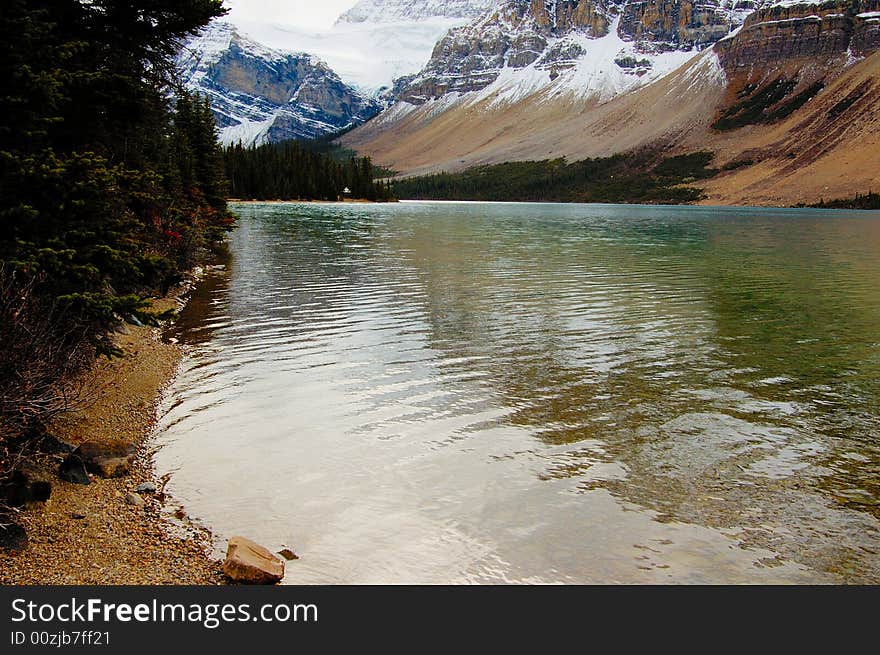 Glacier lake in the mountains in the late fall