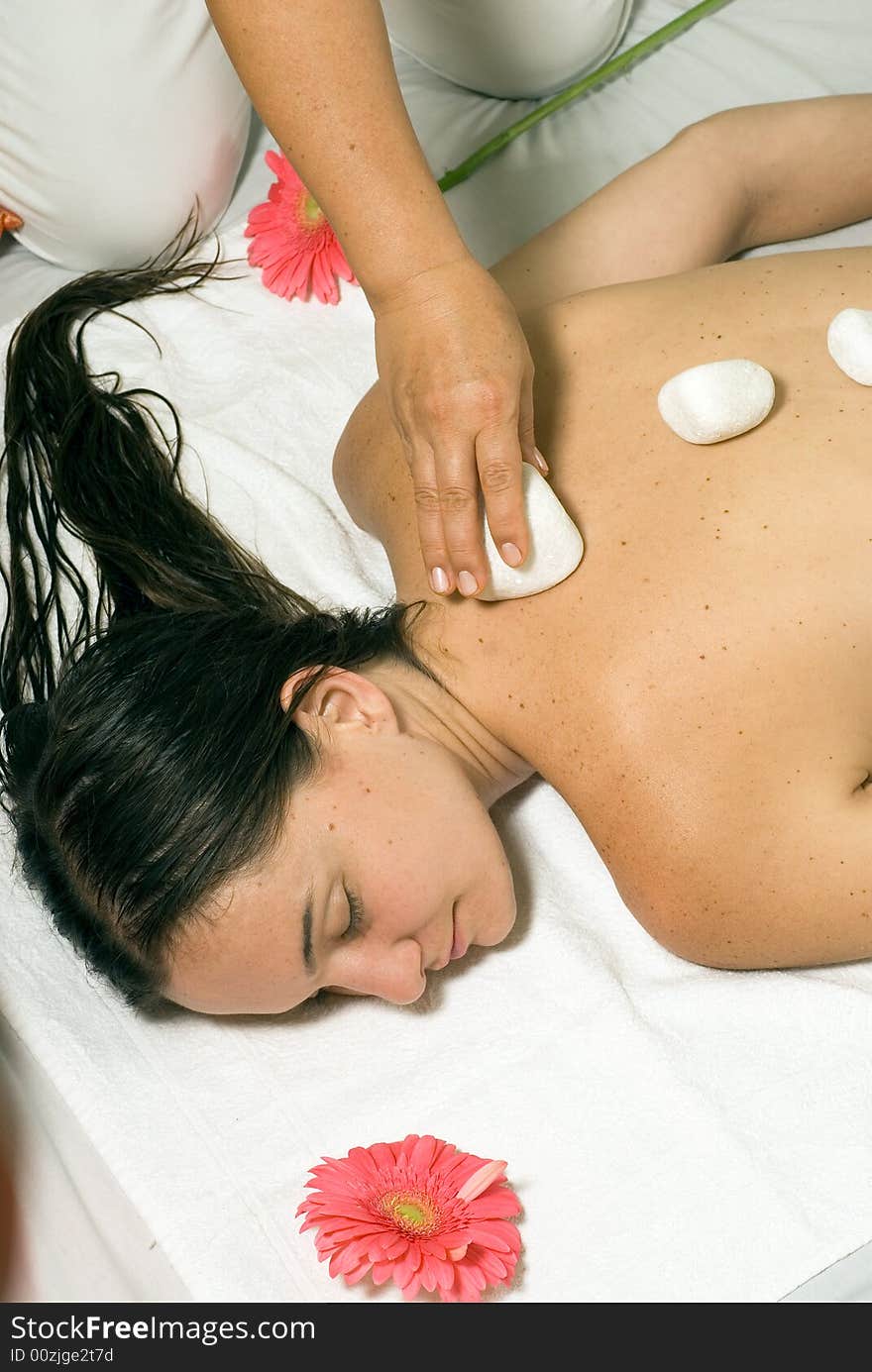 Girl Getting Rocks Put on Back - vertical