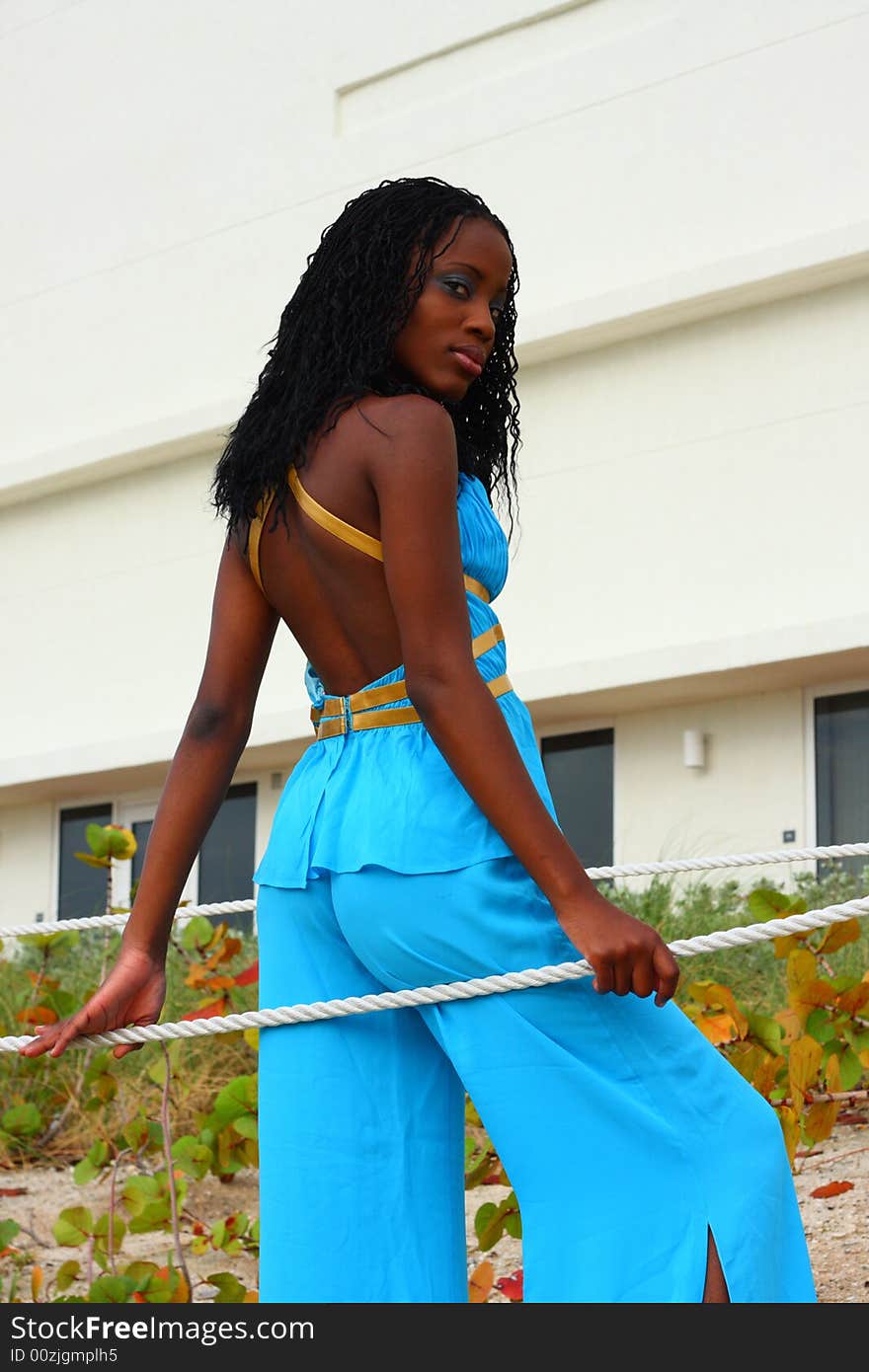 Woman leaning on a rope and looking over her shoulder. Woman leaning on a rope and looking over her shoulder