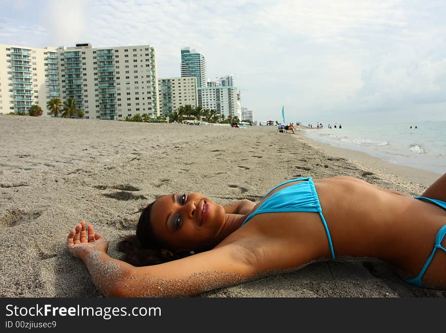 Woman Laying On The Sand