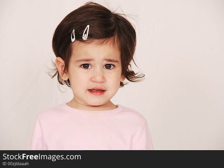 Young toddler girl looking upset after crying. Young toddler girl looking upset after crying