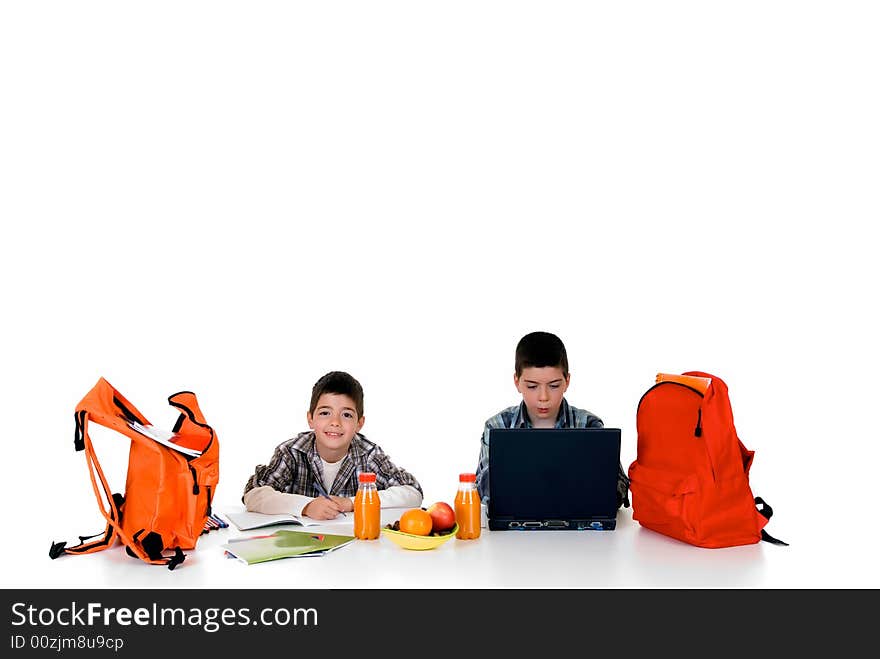 Two young boys doing together studying and homework. Two young boys doing together studying and homework