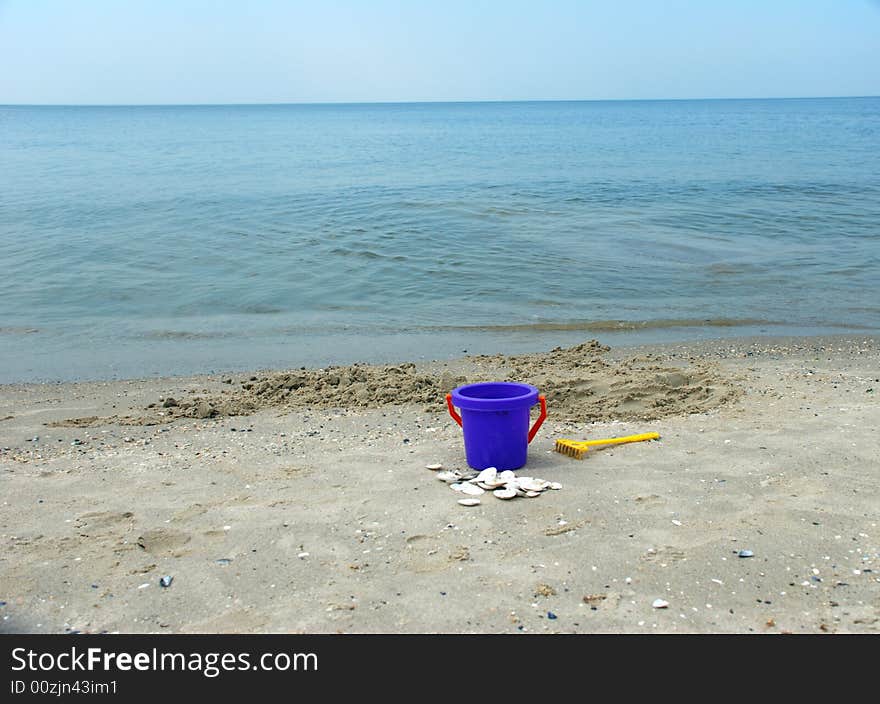 Bucket on sea shore