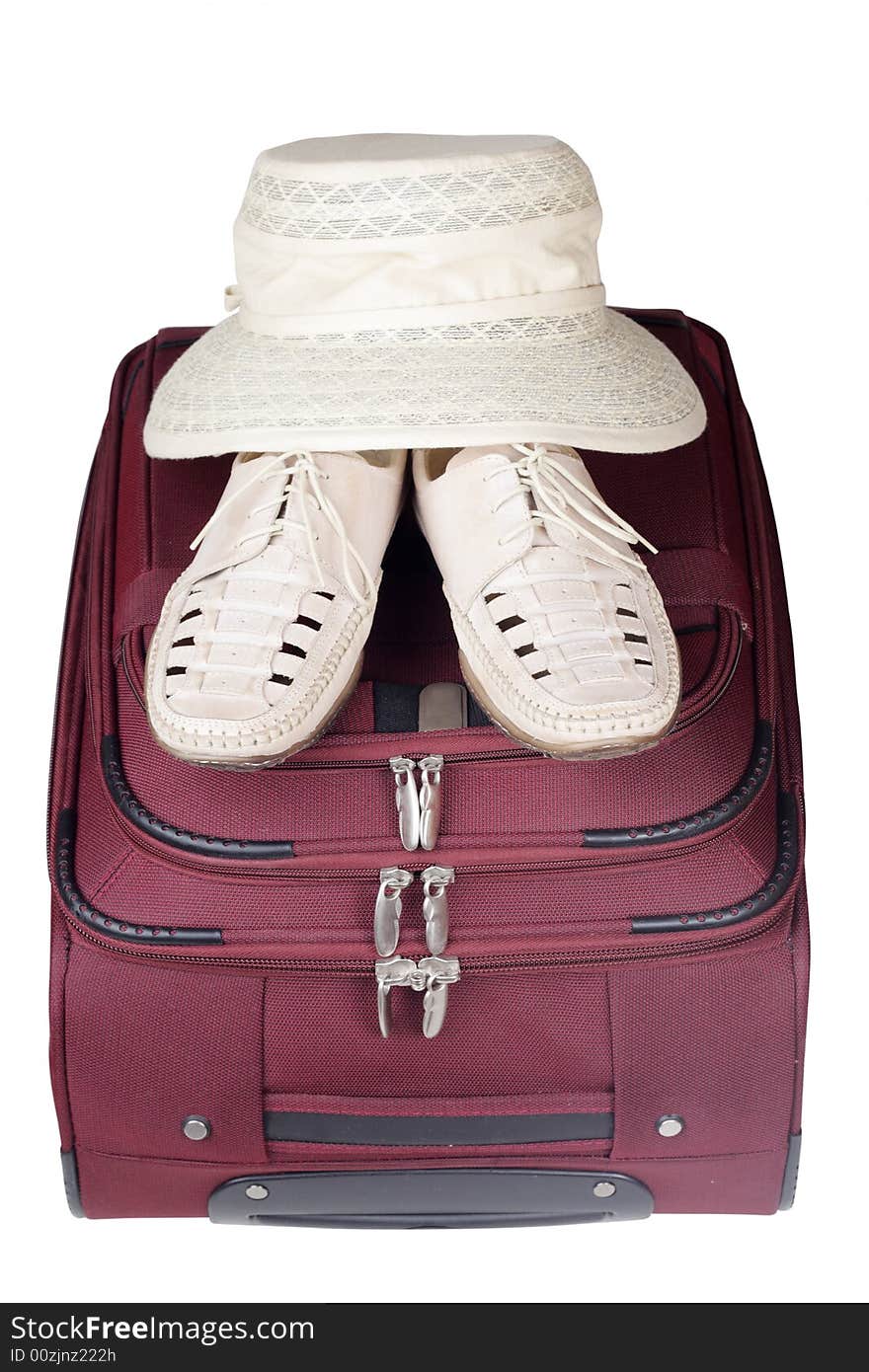 Shoes Pair and Hat on Bag Isolated over White