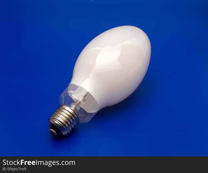 Big Light-bulb on blue background