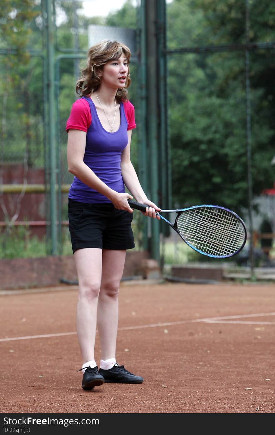 A tennis player girl in action