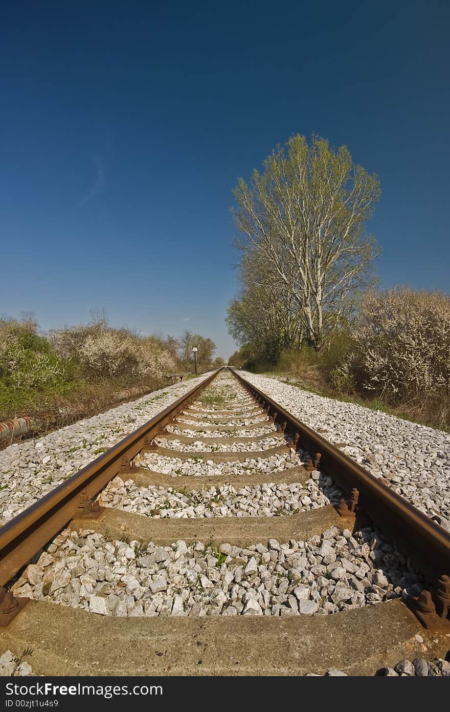 Railroad track vanishing into horizon