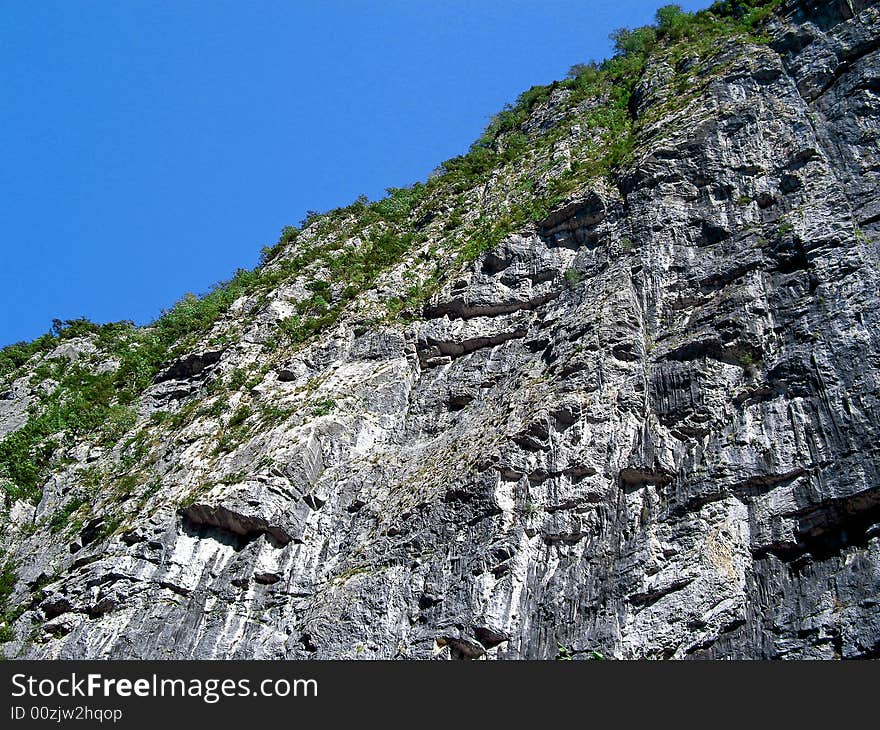 Photo of the rock on background blue sky