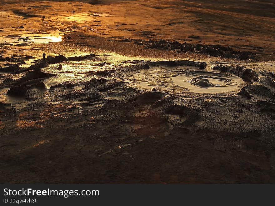 Mud volcano near Buzau, Romania where the sky of the afternoon reflect a beautiful colors on this. Mud volcano near Buzau, Romania where the sky of the afternoon reflect a beautiful colors on this.