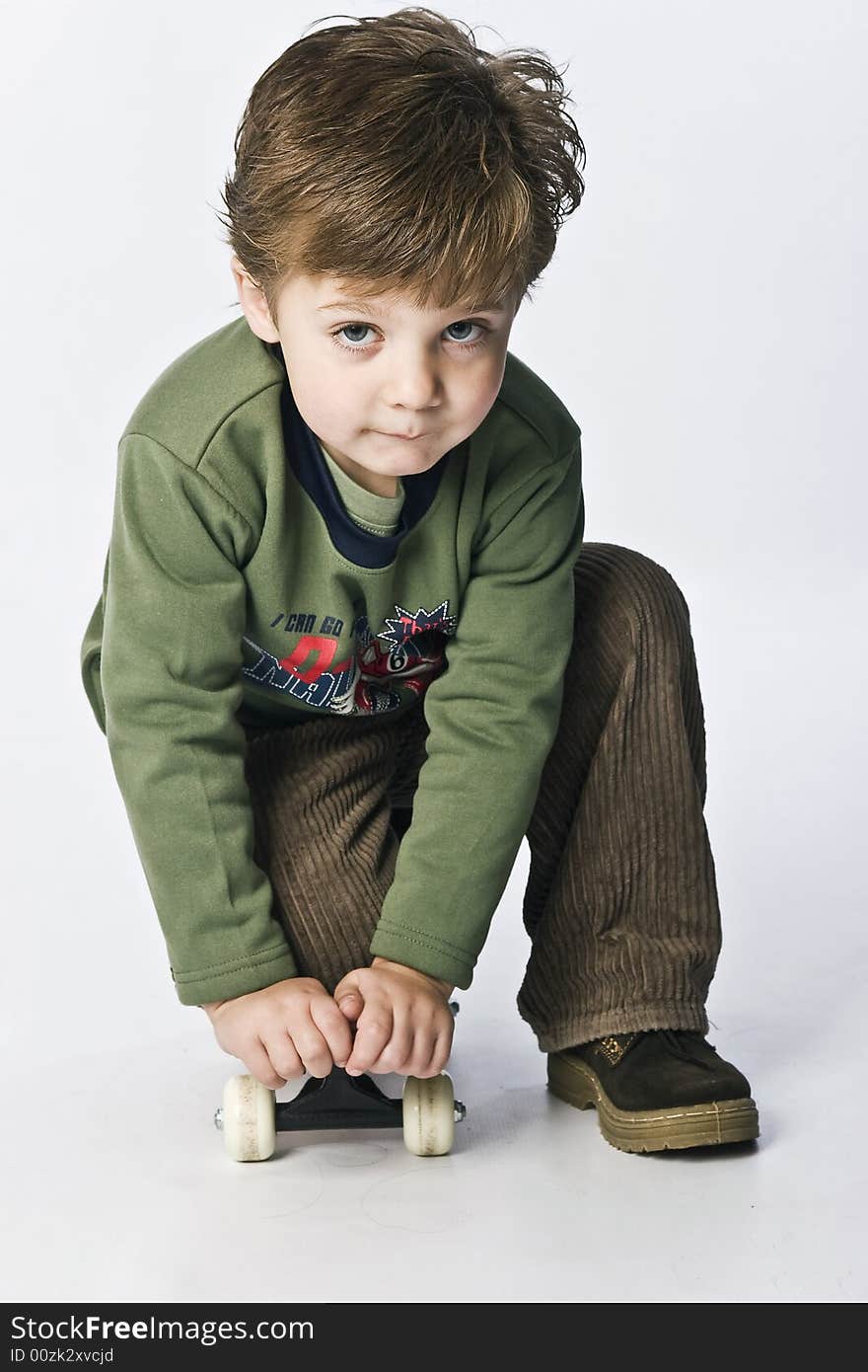 Boy playing with a skateboard. Boy playing with a skateboard