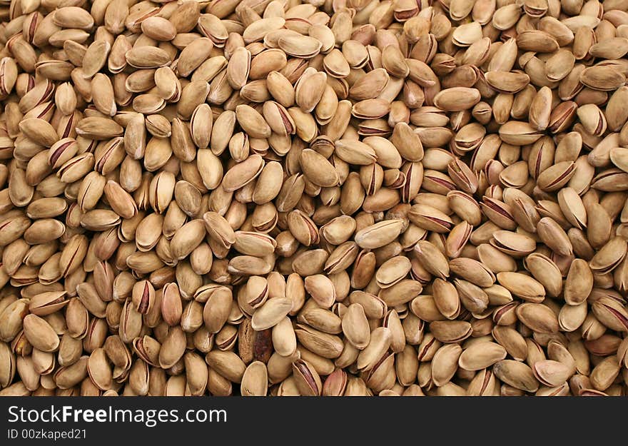 Background of pistachio-nuts. A lot of pistachio.