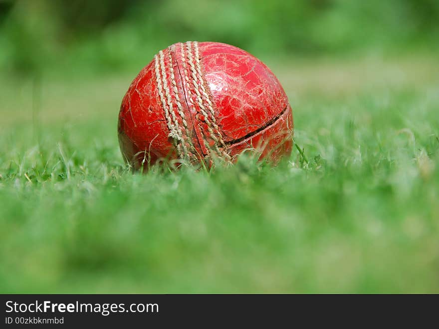 Worn-out old cricket ball that's come to the end of its punishing life. Worn-out old cricket ball that's come to the end of its punishing life