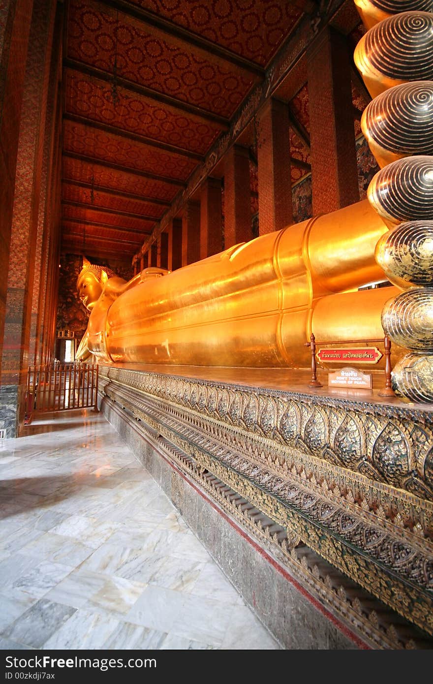 Wat Phra Chetuphon. The Temple of the Golden Reclining Buddha. Detail of the golden statue. Wat Phra Chetuphon. The Temple of the Golden Reclining Buddha. Detail of the golden statue.